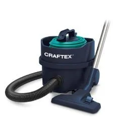 Craftex vacuum cleaner with a hose and floor attachment.