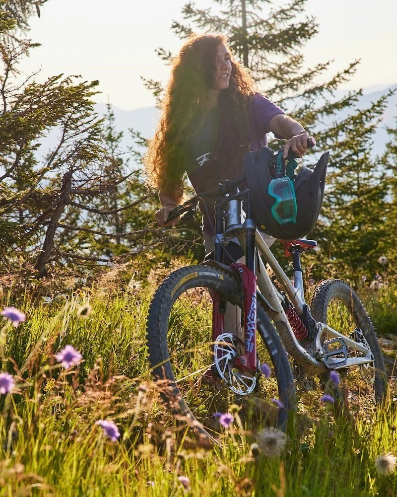 Mountain biker smiling at golden hour with Canon branding, photographed by Joseph Ford for a lifestyle and sports photography campaign