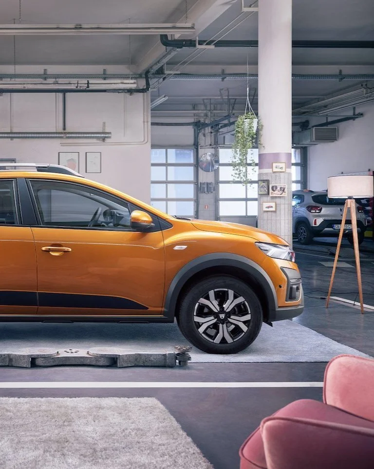 Dacia Sandero Stepway in metallic orange styled like a living room, photographed by Joseph Ford for a creative car advertising campaign blending interior design with automotive branding