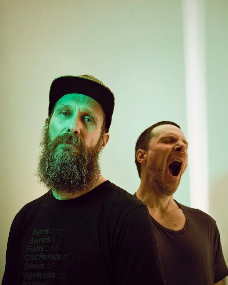 Portrait of Sleaford Mods captured with playful mood and tonal contrast by London-based photographer Phil Fisk for the Observer