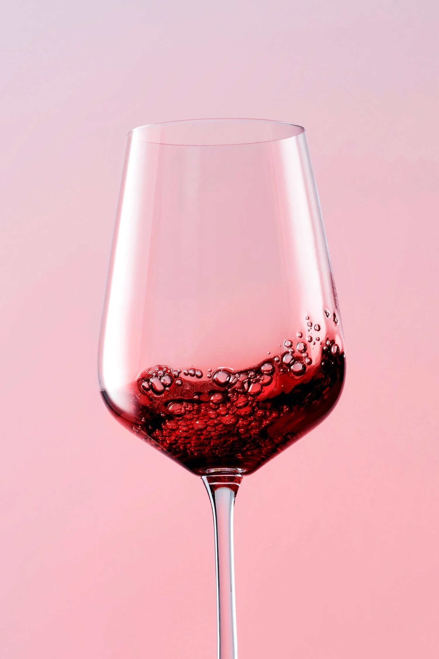 Glass of red wine, swirling, shot by Frankie Turner