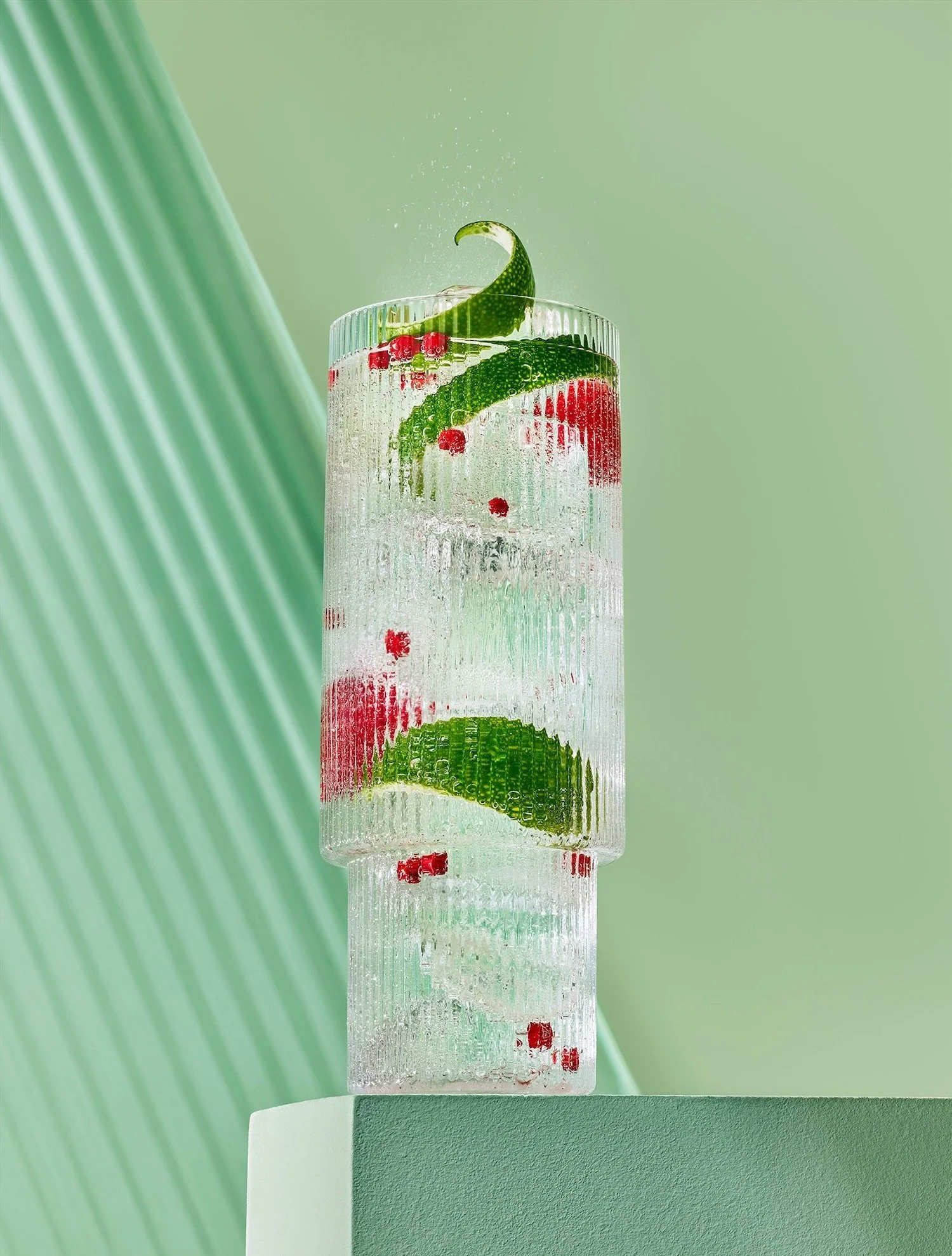 Lind & Lime Gin and tonic with lime, raspberry and pomegranate garnish, photographed by Frankie Turner drinks and beverages photographer