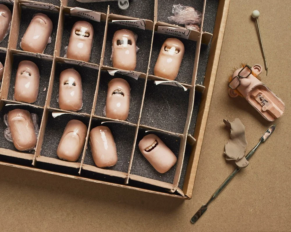 Still life of puppet character facial expressions for Shaun the Sheep stop-motion animation, photographed by Phil Fisk for BAFTA's For the Love of Film campaign. Creative editorial photography by a London-based photographer