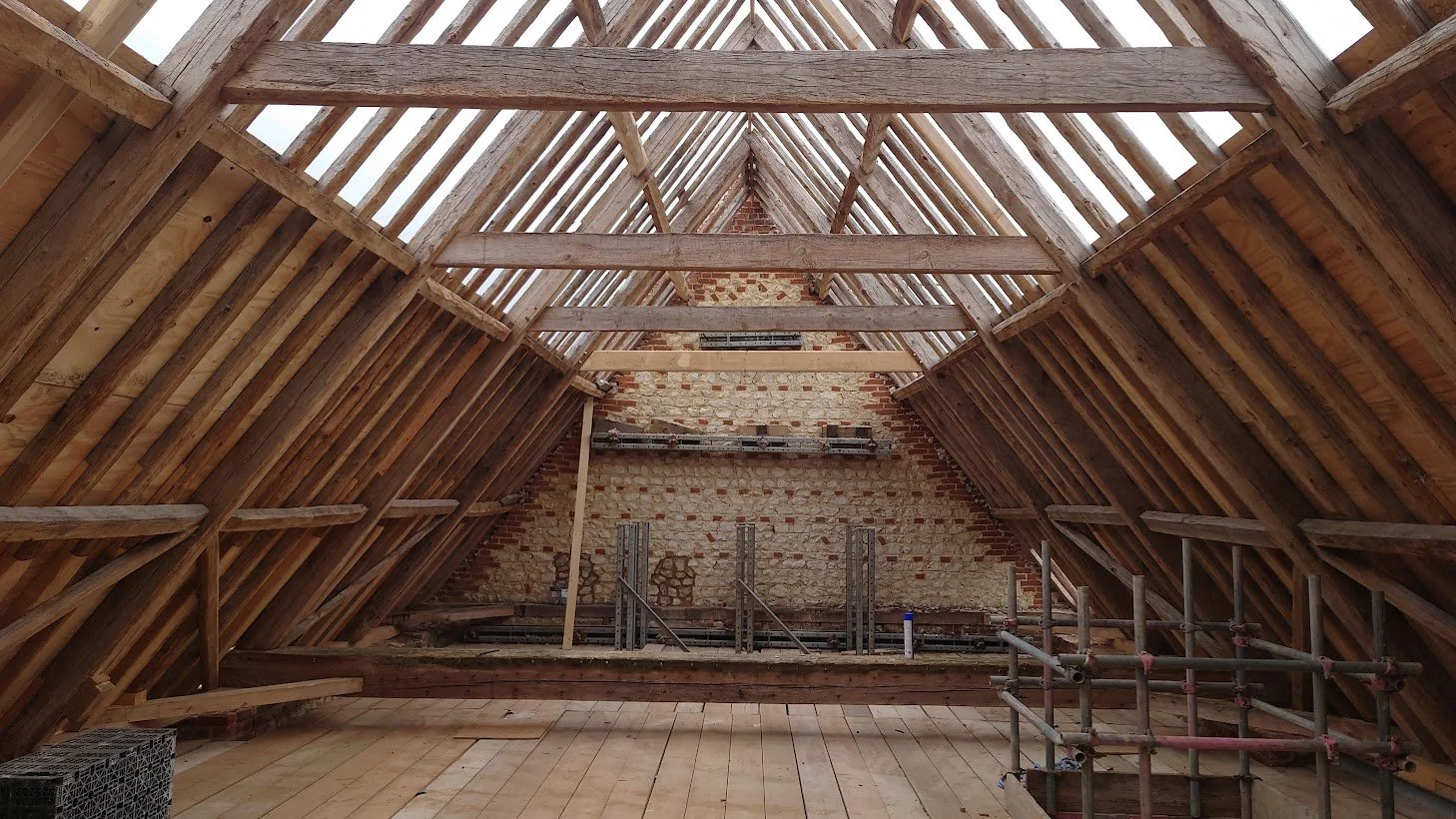 Traditional skills - conservation of the roof timbers before the installation of a high performing thermal and acoustic roof build up. 