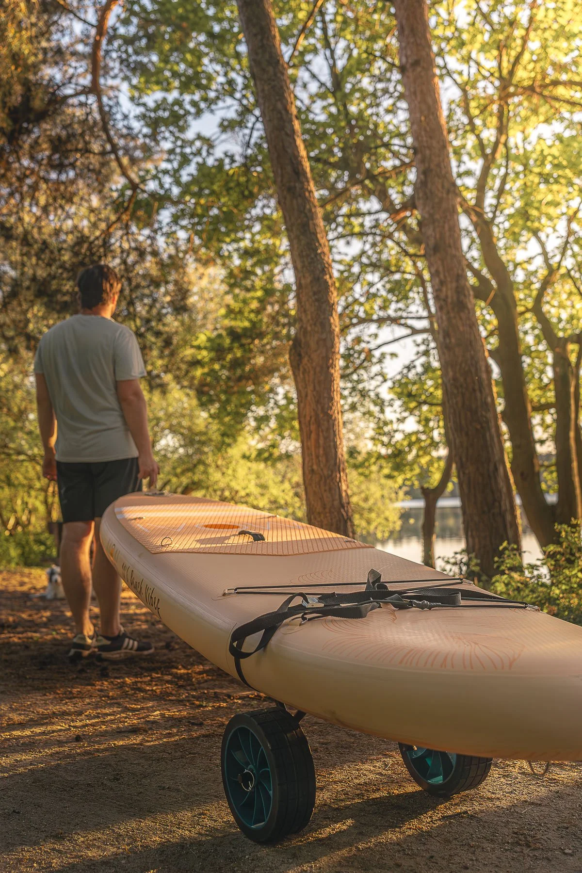 Outdoor lifestyle photography showing the transport and preparation of a paddleboard