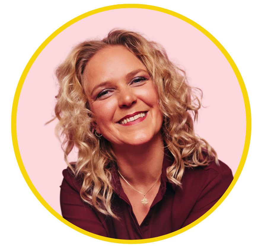 A smiling woman with curly blonde hair wearing a maroon blouse and a necklace, against a pink background with a yellow border. Karoliina Jarenko.