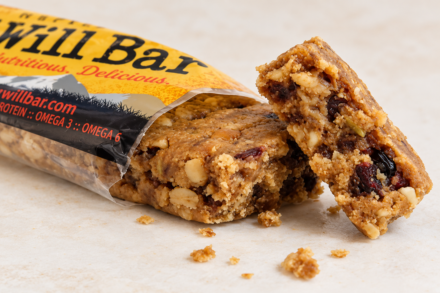 Will Bar snack bar partially unwrapped, showing nuts, dried fruit, and chocolate chips.