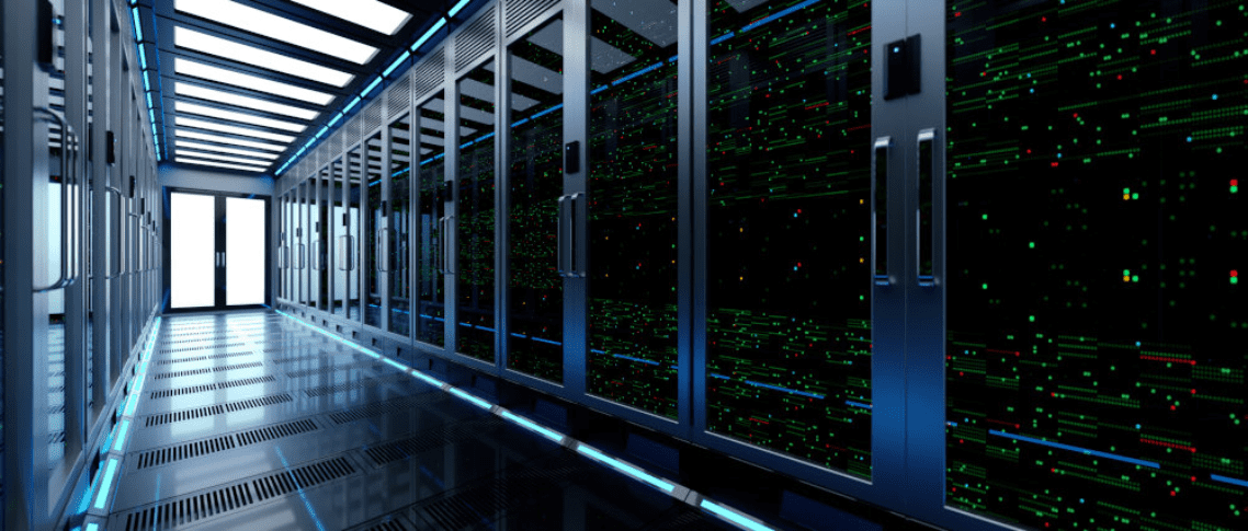 A futuristic data center hallway with glass server cabinets filled with glowing, multicolored electronic circuits and a bright door at the end.
