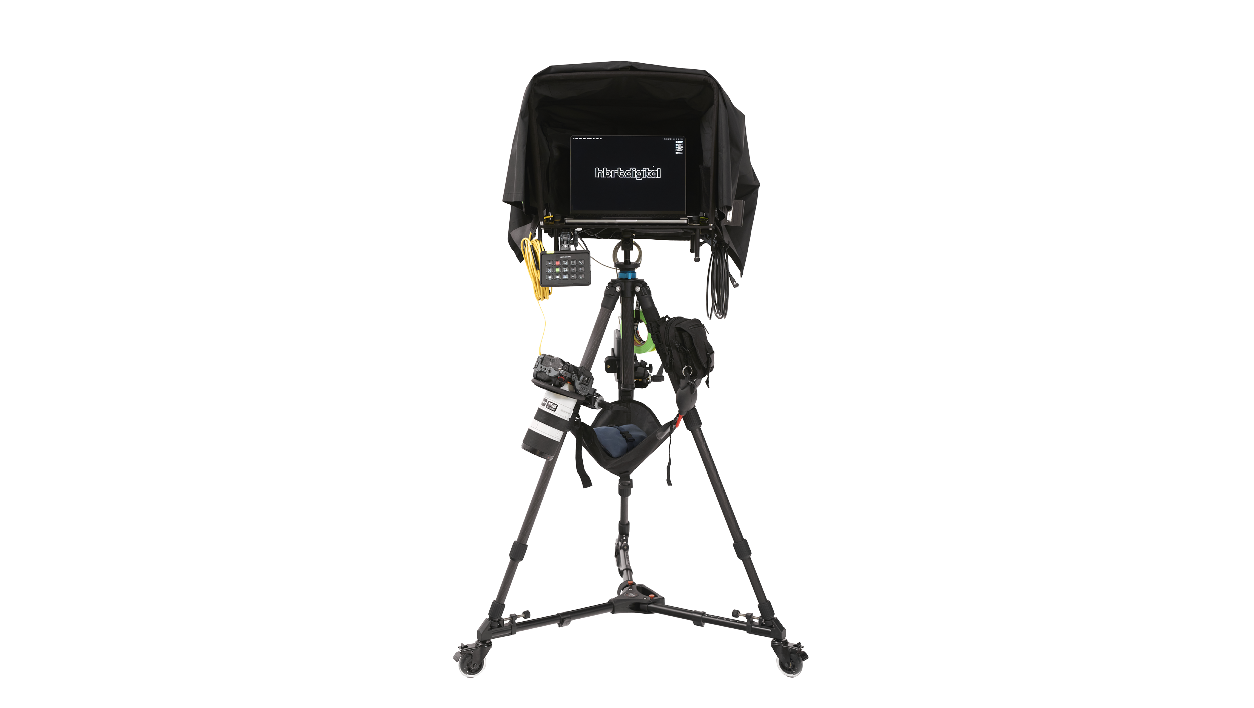 Photography setup with camera on a tripod, monitor, and connected equipment; studio lighting gear present.