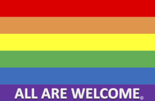 A rainbow flag with the words 'All Are Welcome' written in white letters at the bottom.
