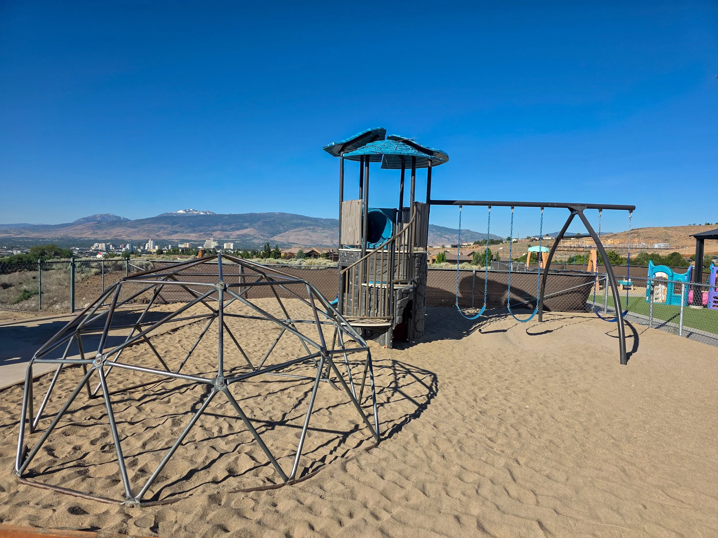 Children enjoy outdoor play on Little Lites Christian Learning Center's large playground in Reno, Nevada. Our secure play area features climbing structures, swings, and age-appropriate equipment designed to support physical development, social skills