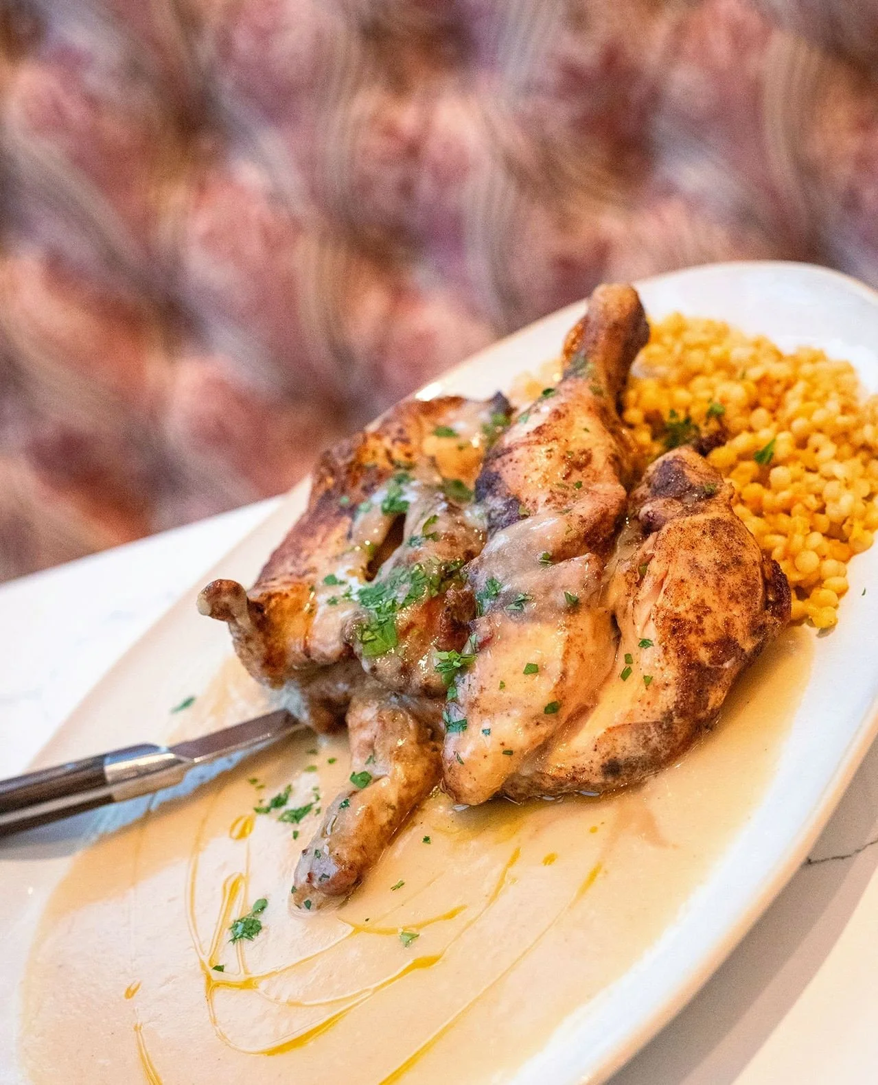 Chef went Feast Mode with this one.⁠
⁠
Our ROASTED WHOLE CHICKEN is a centerpiece in every sense &mdash; all-natural FreeBird chicken, seasoned with ras el hanout and finished with a preserved lemon velout&eacute; over pearl couscous. Richly spiced, 