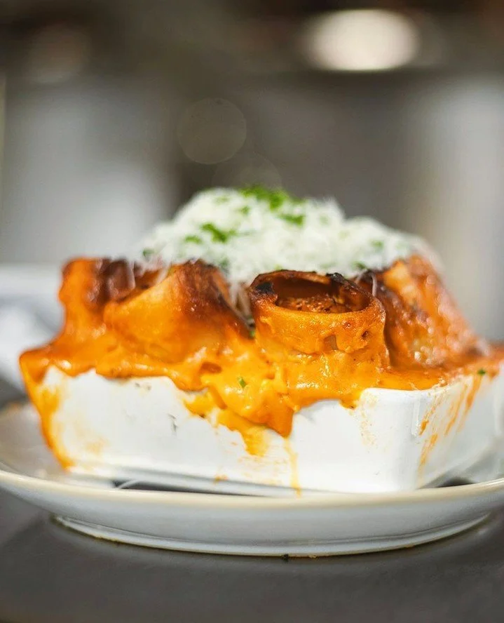 "What's one dish I have to order?"⁠
⁠
If you're dining at Vivienne, start with the Paccheri Ripieni. Filled with pork sausage and fontina, layered with tomato b&eacute;chamel, and finished with pecorino, it's become one of the defining dish