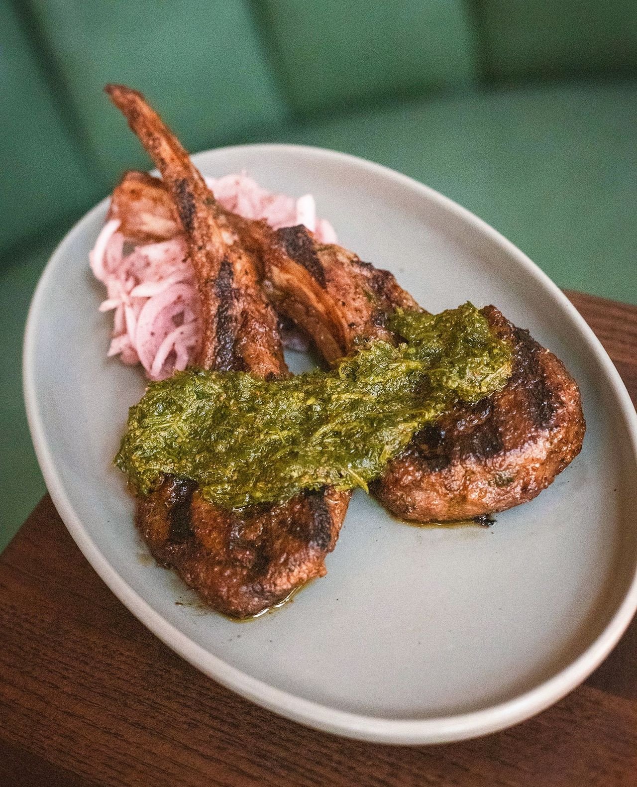Charred over the grill. Brightened with sumac and herbs.⁠
⁠
Our Grilled Lamb Chops are paired with sumac-marinated sweet onion, green chermoula and parsley&mdash;a signature meze plate built around simplicity and balance. ⁠
⁠
Join us at Vivienne and 