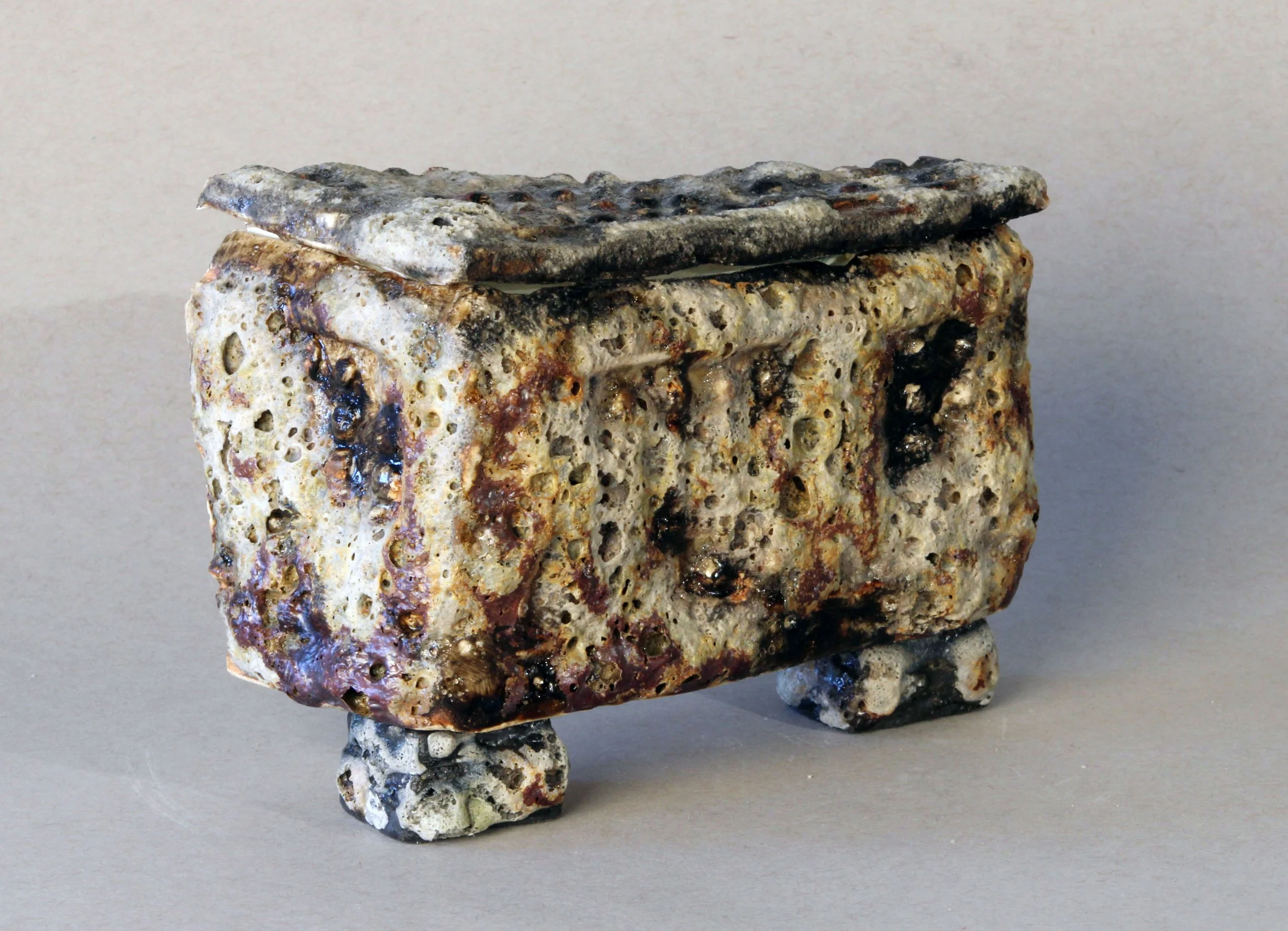   Box Fragment: Exterior,  2025 Stoneware, experimental glazes that include pumice dating to 79 AD, ceramic decal prints made from original watercolor paintings Approx. 5 x 4 x 2 inches   