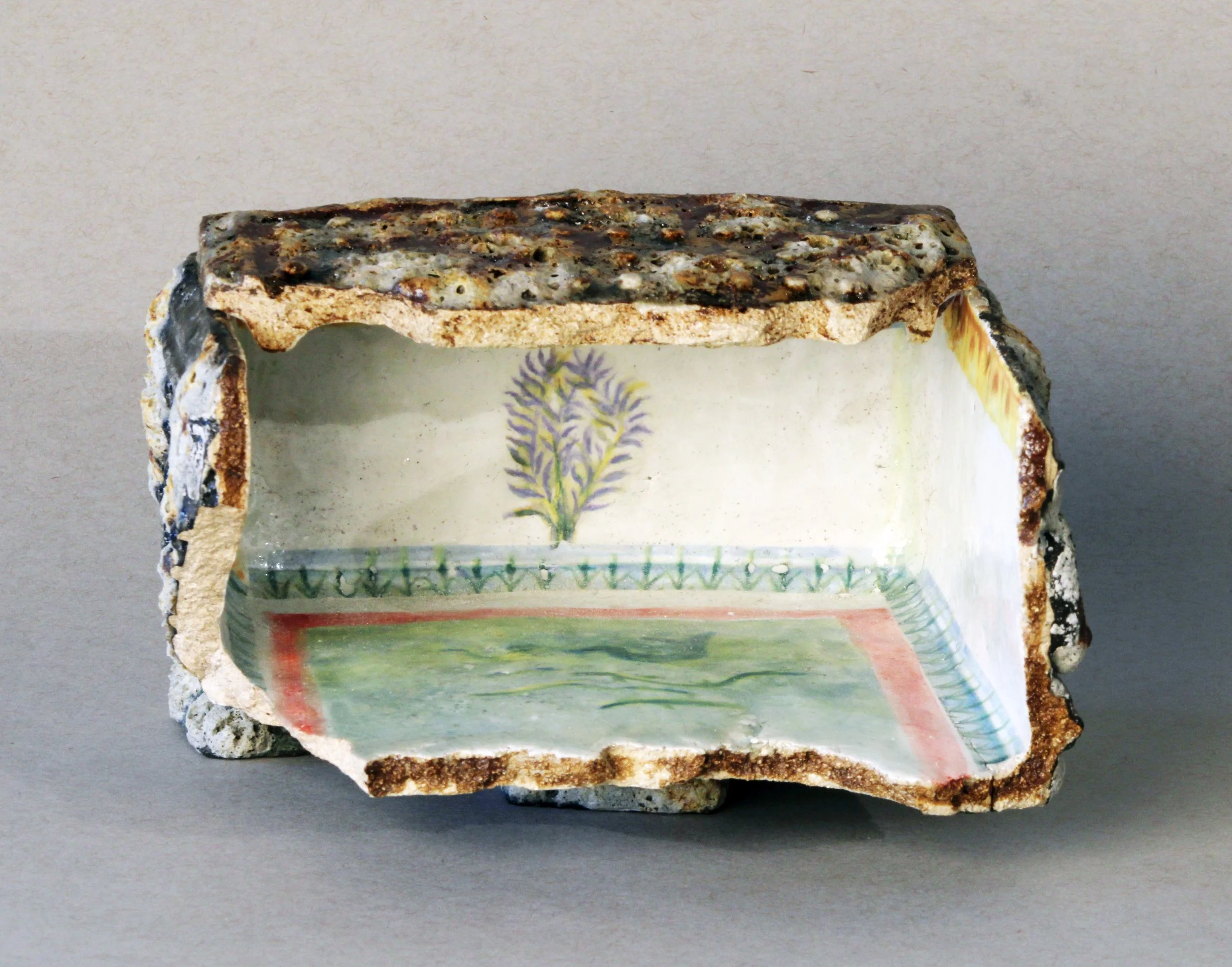   Box Fragment: Bush with Pool,  2025 Stoneware, experimental glazes that include pumice dating to 79 AD, ceramic decal prints made from original watercolor paintings Approx. 8 x 4 x 2 inches   