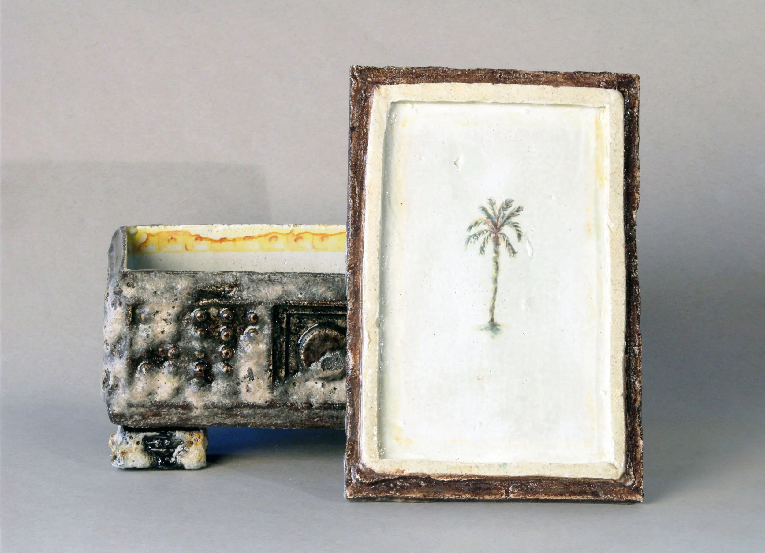   Box Fragment: Open Box with Interior,  2025 Stoneware, experimental glazes that include pumice dating to 79 AD, ceramic decal prints made from original watercolor paintings Approx. 8 x 6 x 4 inches   