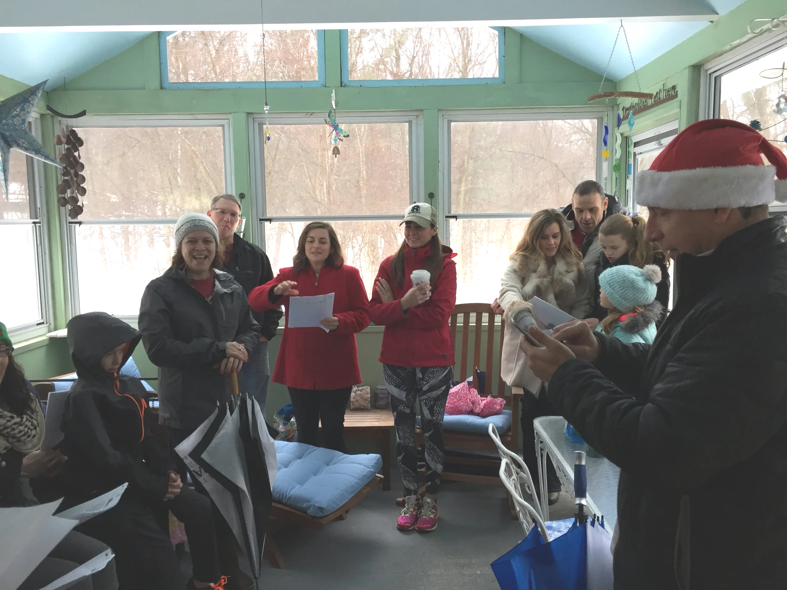 Best Christmas present EVER!!   Members of my gym gather on my porch, in pouring rain to carol for me on Christmas Eve.  