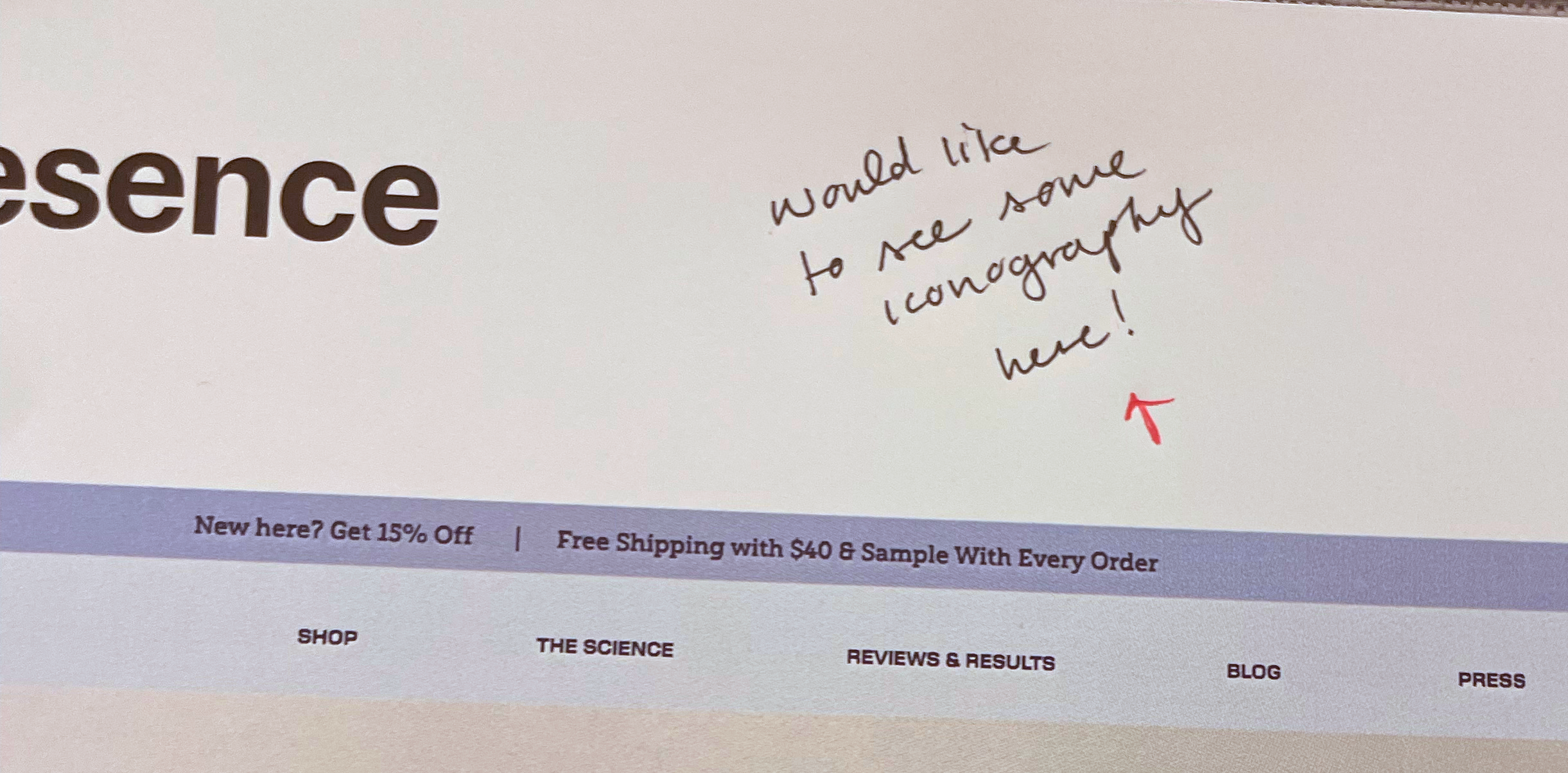 Handwritten note saying "would like to see some iconography here" with a red arrow pointing downward