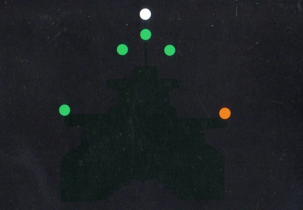 A night view of a ship's lights, showing six different white, green and red lights, used to train awareness of how to identify different vessels, using displayed lights only, in total darkness