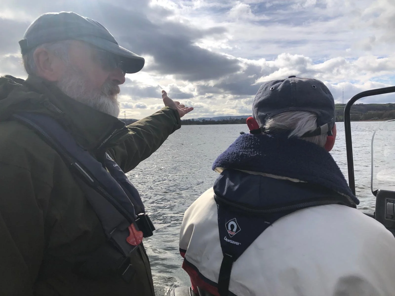 An instructor and a student on the water in a RIB during an RYA Powerbaot course