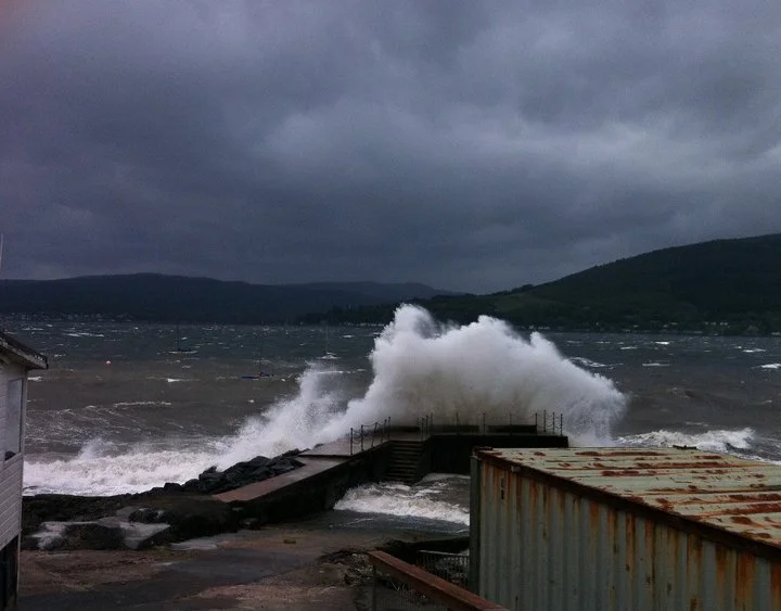 waves crashing onto a shore during a storm