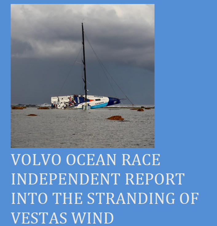 Sailboat partially capsized on the ocean, with dark storm clouds in the background.