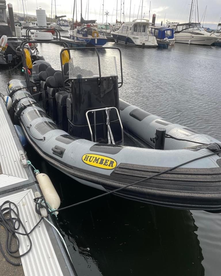 You & Sea's new training boat 'Maverick' docked in Rhu Marina with multiple sailboats and yachts in the background.
