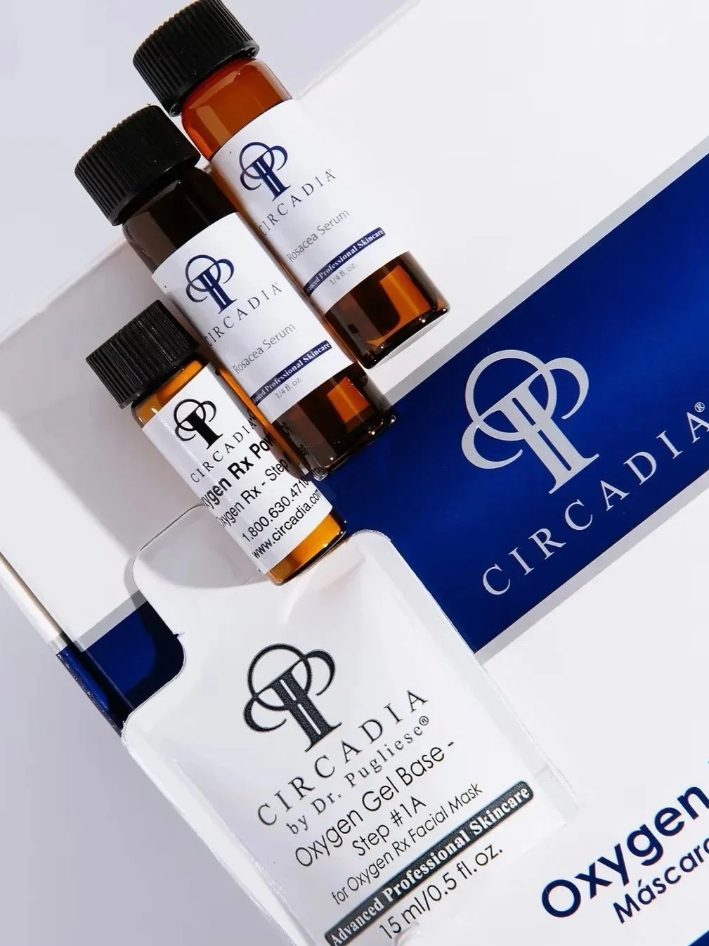 Three small bottles of Circadia skincare products and a box with Circadia branding, including a facial mask and serum, shown on a white surface.