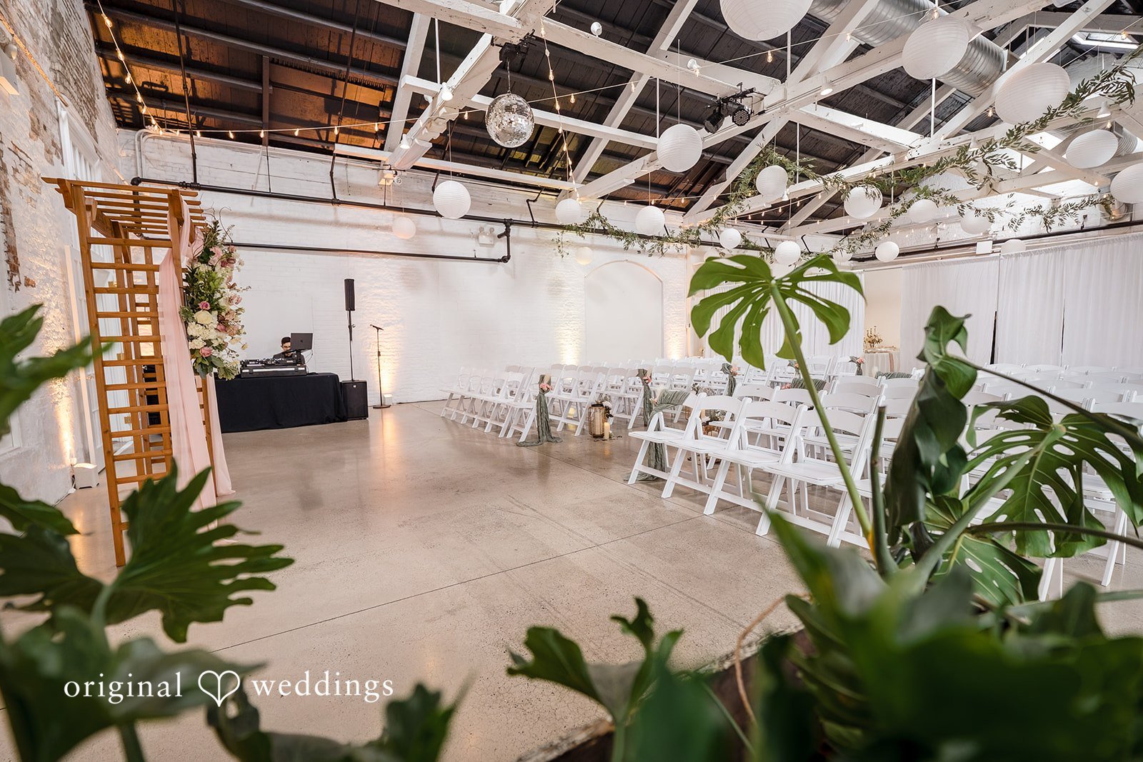 Beautiful ceremony set up in the main room with tropical plants