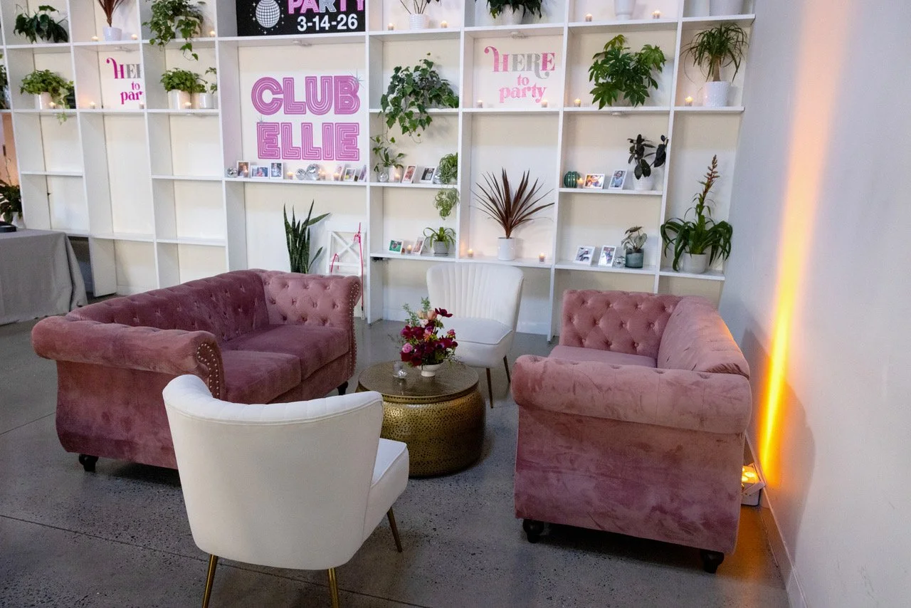 Main room lounge area by shelving unit