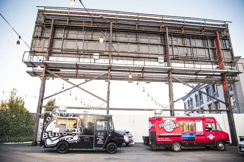 2 food trucks serving guests in our courtyard