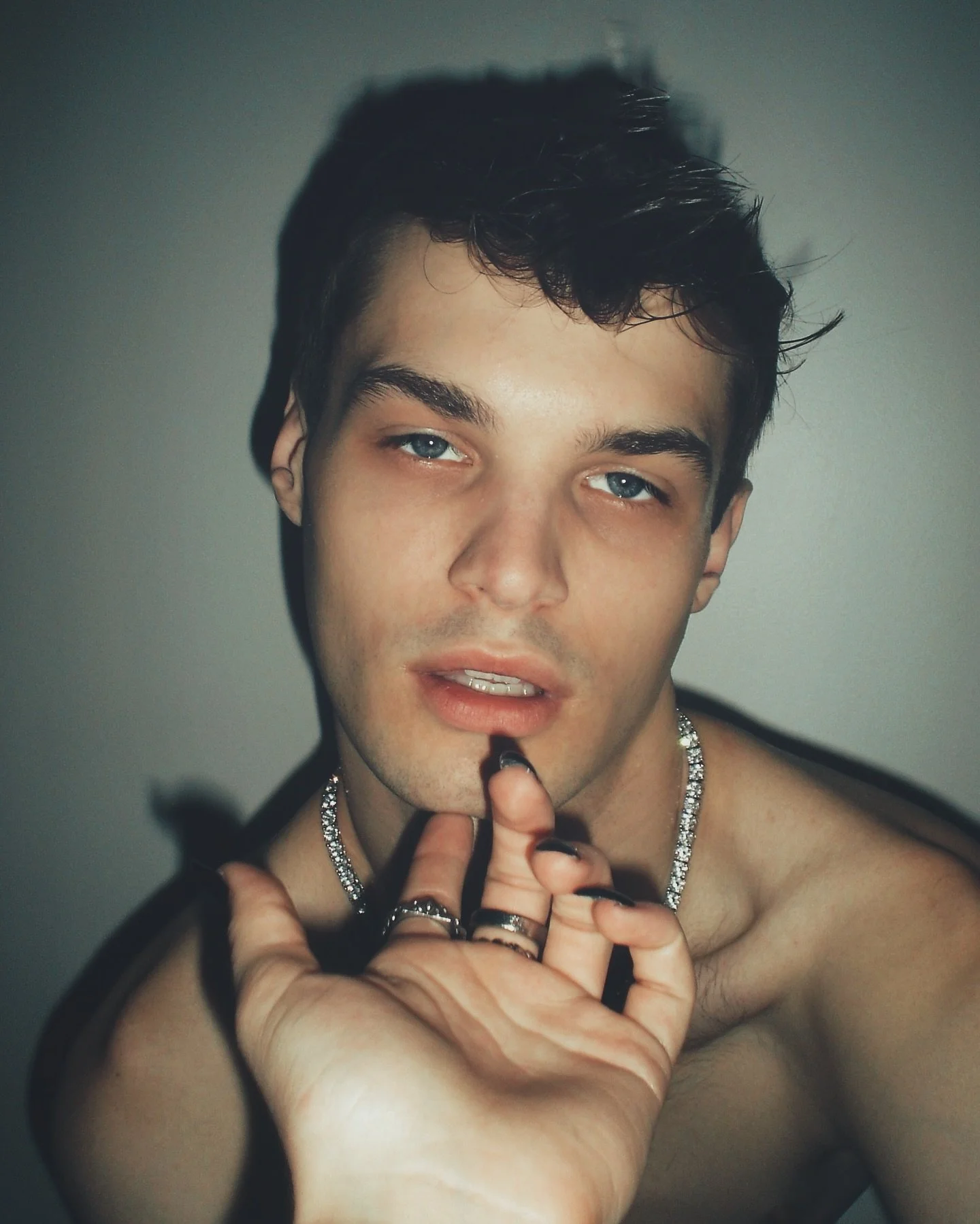 her fresh manicure were like daggers across the skin.
