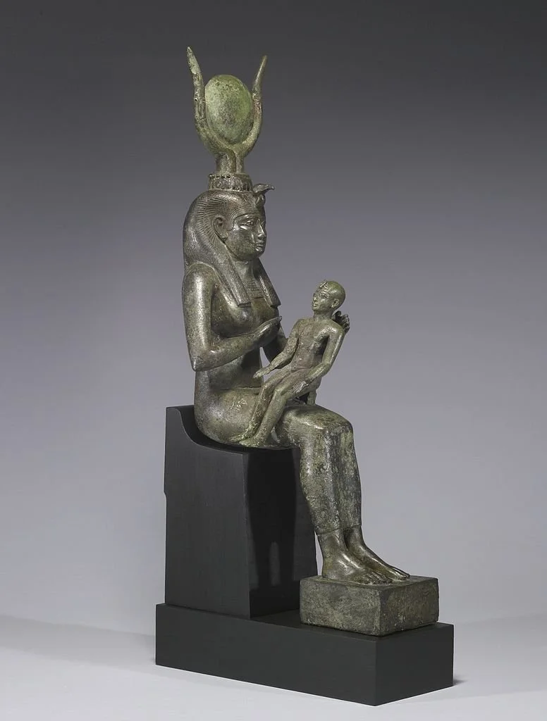 776px-Egyptian_-_Isis_with_Horus_the_Child_-_Walters_54416_-_Three_Quarter_Right.jpeg