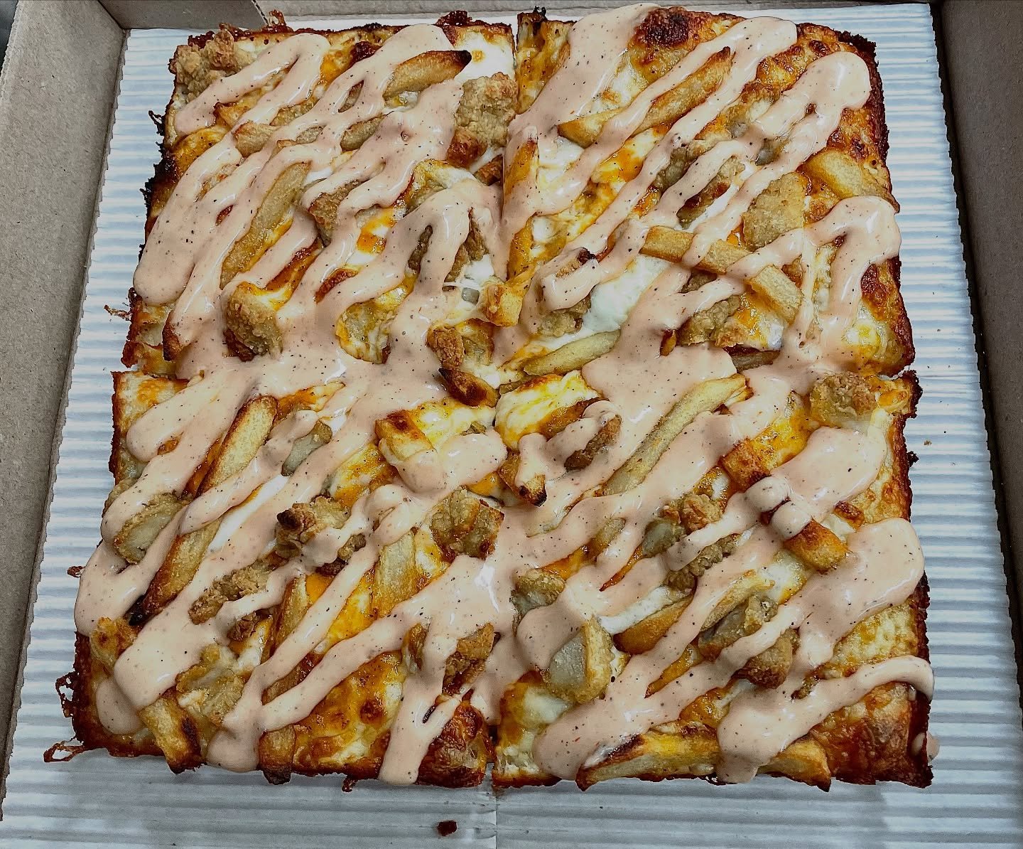 Breaded Chicken Breast, Fries, House-Made Kano Sauce

Last year, we were goofing around in our kitchen on a slow night and thought we&rsquo;d try making a pizza from one of our favorite chicken spots.

Sure enough, everyone loved it🐔

So, we thought