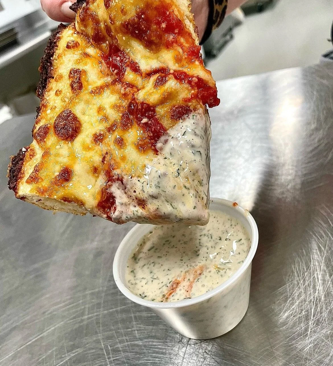 The hot topic of ranch on pizza is 1 of about 10 things I was shocked to know people fought about. Before opening a pizzeria, I had no clue these topics were so fiercely debated on the inter-webs.

We make ours from our own custom recipe. No mixes. N