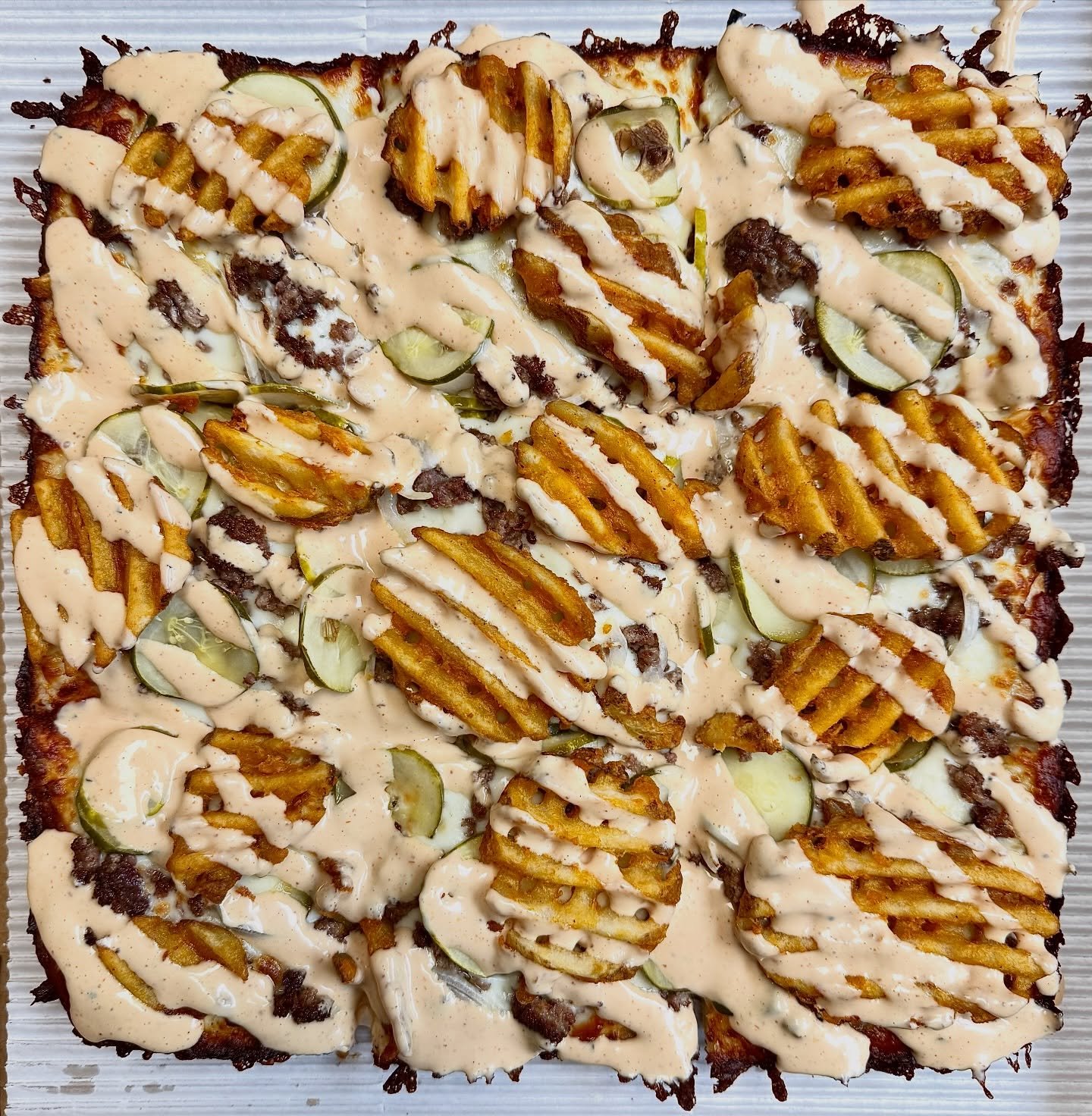 The Donkey Kong has rapidly climbed the ladder into the ranks of our most popular pizzas‼️

Cheese, burger, onion, pickles, waffle fries, smash sauce 🍔🍕

Weird? Yeah, maybe.
But if you think about pizza as a giant open-faced sandwich&hellip; sudden