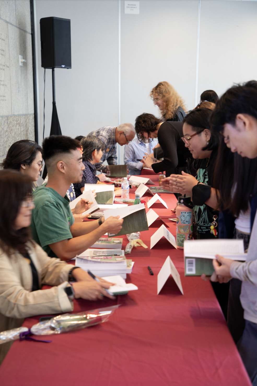 2024 Book Launch_Book contributor signing.png