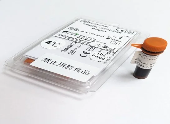 A medical test kit with a container and instructions in a plastic tray