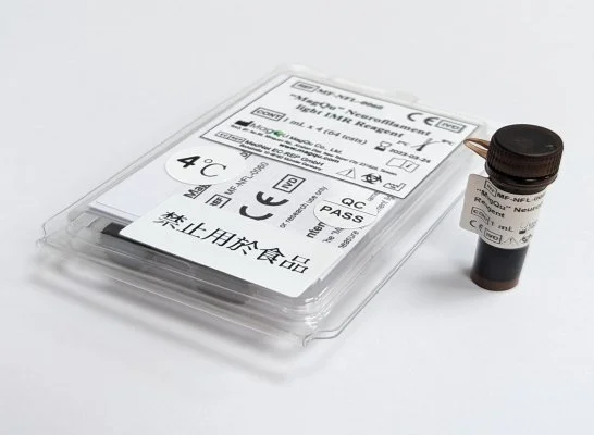 Medical test tube with a black lid and a label next to a sealed plastic package containing a climate measurement device, both on a white background.