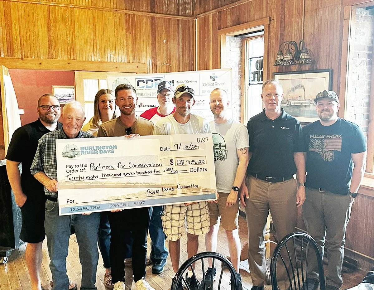 Group holding a big check