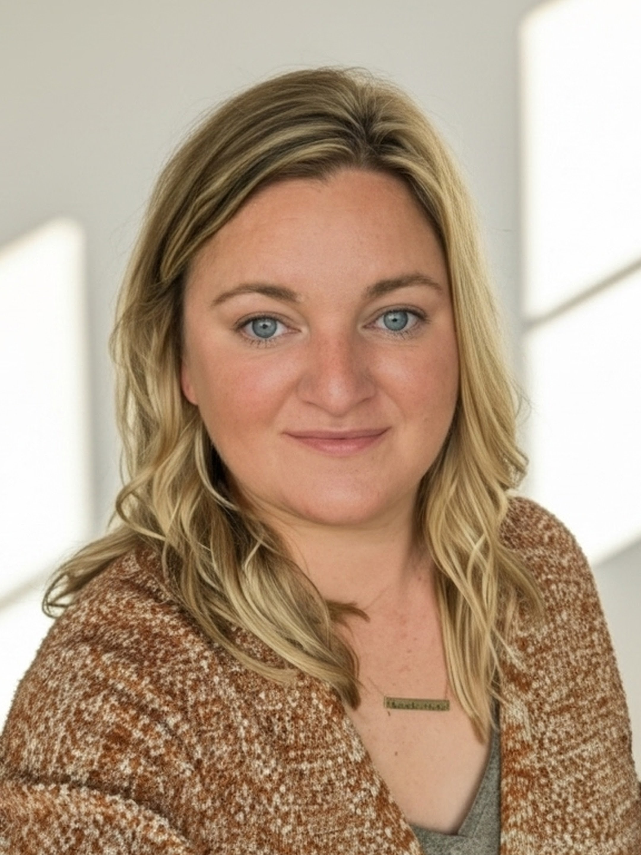 Headshot of a woman with blonde hair
