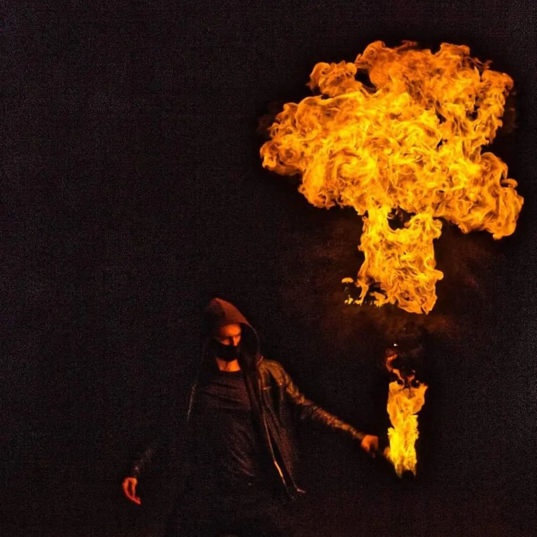 Skilled fire performer showcasing a dramatic gulf flame effect as part of a high-impact live entertainment show