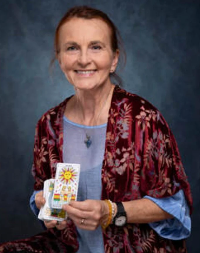 Tarot reader Marchia holding tarot cards. for weddings and events North West England