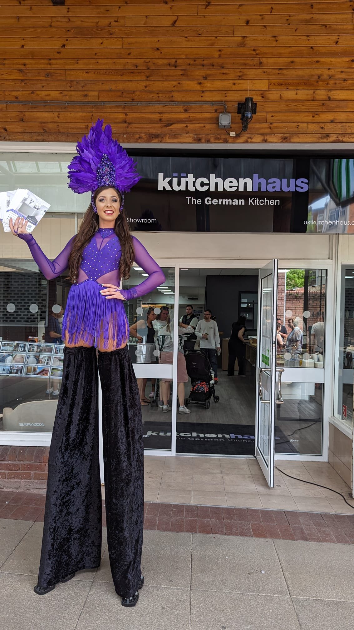 Store opening stilt walker entertainment