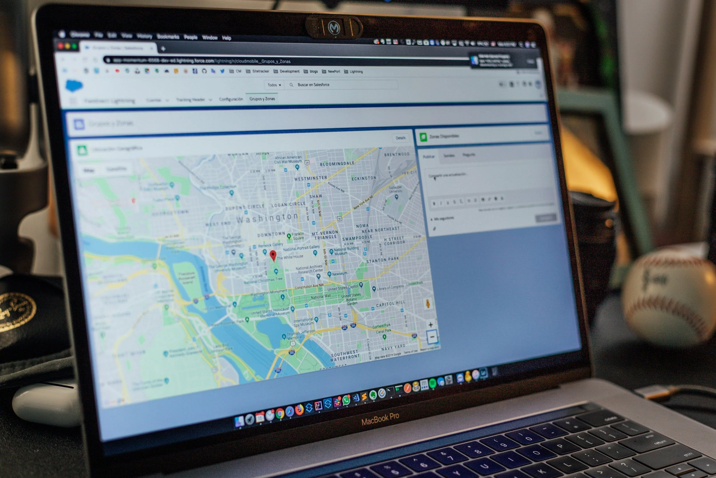 Laptop displaying a map of Washington, D.C., including landmarks such as the National Mall, U.S. Capitol, and various neighborhoods.