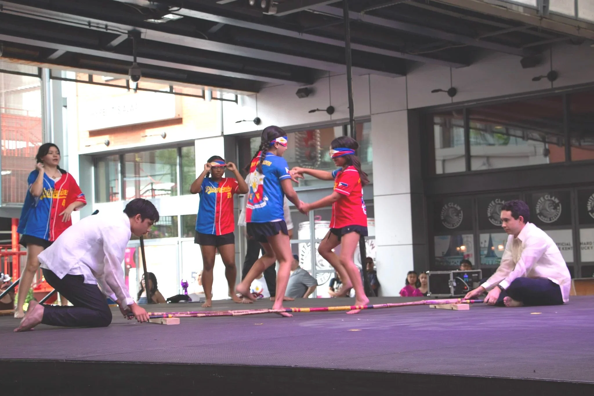 Young performers with Cultura Philippines dance the Tinikling blindfolded.  (Photo by McKenzie Gary, 2026.)