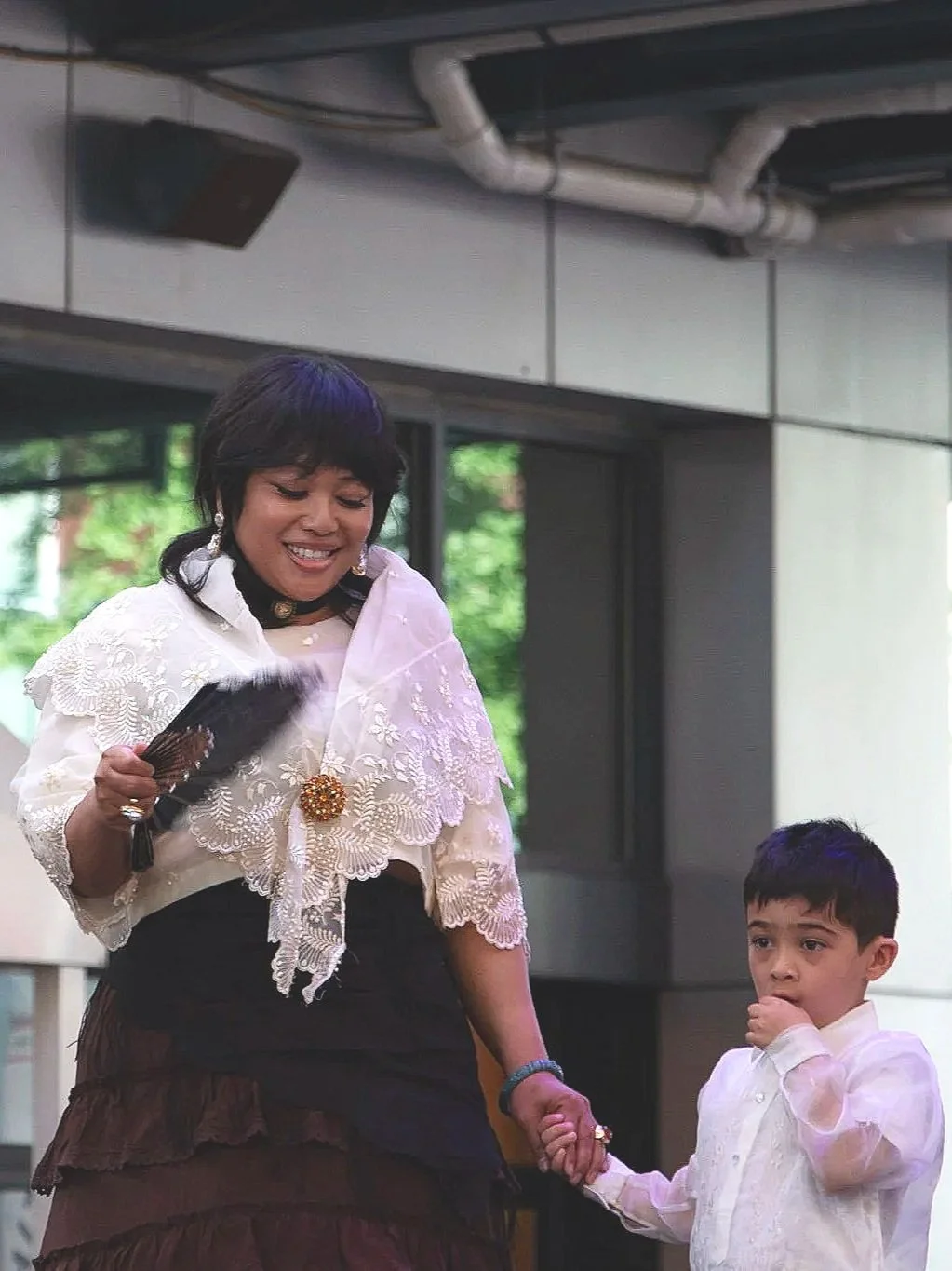Model Lisette Gamboa and nephew Ronan McGue show off the Maria Clara and Barong Tagalog. (Photo by McKenzie Gary, 2026.)