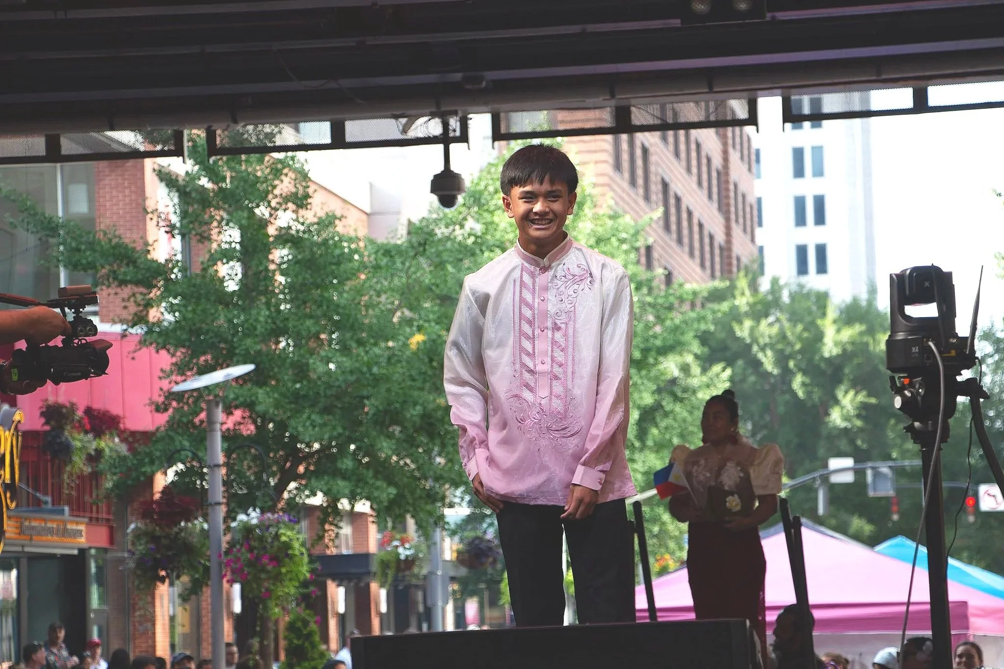Joshua Visaya model displays his modern pink Barong Tagalog. (Photo by McKenzie Gary, 2026.)