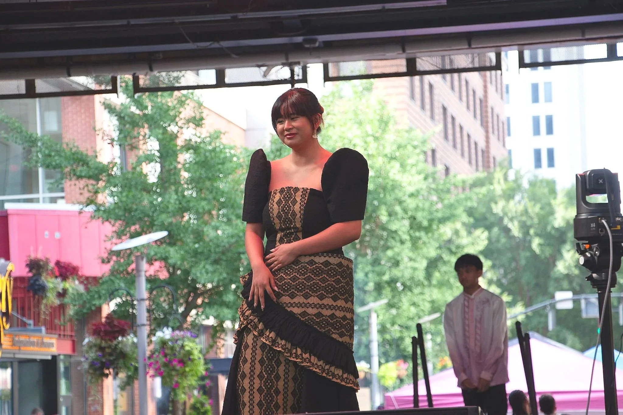 Samantha Visaya displays her modern Filipiniana dress with woven textiles during the fashion show. (Photo by McKenzie Gary, 2026)